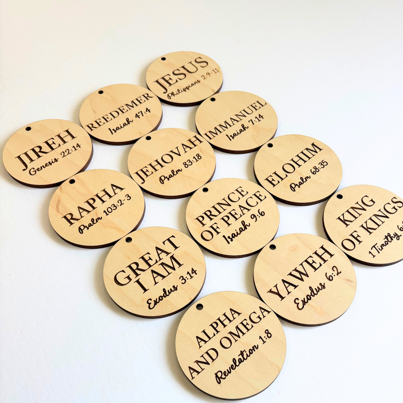 Wooden tags with engraved religious text on a white background