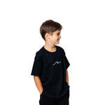 Child wearing a black t-shirt with a white logo on a white background